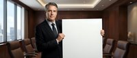 Professional middle-aged Caucasian businessman in dark suit holding blank white sign in modern conference room with city view for presentations.
