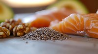 Fresh salmon slices with chia seeds, walnuts and avocado on wooden cutting board, healthy omega-3 rich ingredients for nutritious meal preparation.