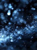 Magical blue bokeh lights and glowing particles on dark background create dreamy atmospheric effect for festive designs and holiday projects.