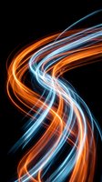 Abstract glowing neon light waves in orange and blue flowing across black background. Modern digital art for technology, energy, and motion design projects.