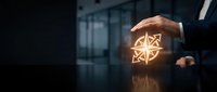 Businessman holding glowing geometric star symbol representing innovation, success, and strategic business growth in modern corporate environment.