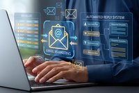 Professional businessman using laptop with digital email marketing interface and automated reply system holographic display for business communication.