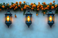 Three glowing vintage lanterns mounted on blue wall with blooming orange marigold flowers creating romantic garden atmosphere. Perfect for outdoor decoration.