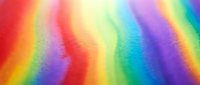 Vibrant rainbow gradient background with smooth color transitions from red to purple, creating an abstract multicolored spectrum for creative designs.