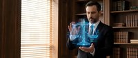 Professional businessman in dark suit presenting holographic financial data charts and graphs in elegant office library setting with wooden shelves and natural lighting.