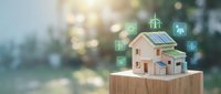 Smart home technology concept with miniature house model featuring solar panels and digital icons representing energy efficiency and automation systems.