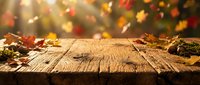 Rustic wooden table with autumn leaves and bokeh lights, ideal for fall seasonal marketing, product displays, and holiday promotional backgrounds.