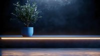 Minimalist olive tree in blue pot on dark surface with dramatic lighting and glowing LED strip, creating modern atmospheric interior design scene.