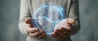 Caucasian male holding a glowing digital hologram sphere with futuristic data lines, representing AI, technology, and innovation concepts.