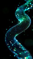 Glowing turquoise and blue particles form a flowing spiral wave against black background, creating magical light trail effect with bokeh and sparkle elements.