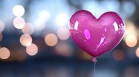 Pink heart-shaped balloon floating against blurred bokeh lights background creates romantic atmosphere for Valentine's Day, wedding or anniversary celebrations.
