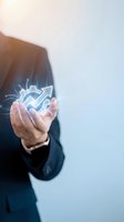 Businessman holding glowing gear icons representing innovation and technology solutions for modern business development and digital transformation.