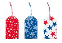 Patriotic star gift tags with twine hanging strings, isolated on white background, ready for holiday wrapping and festive decoration design projects.