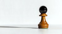 Wooden chess pawn piece with dramatic shadow on white surface, highlighting strategy and leadership concepts in business and game planning.