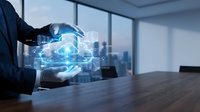 Businessman hand holding holographic cloud computing technology with digital data network icons in modern office conference room for tech innovation.