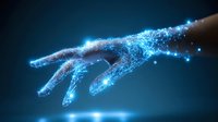 Glowing digital wireframe hand reaching forward with blue light particles and energy effects against dark background, symbolizing artificial intelligence and technology.