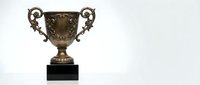 Bronze trophy cup with ornate handles on black base isolated on white background for awards ceremonies and competitions.