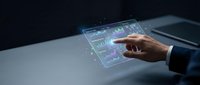 Businessman hand touching holographic data visualization interface with financial charts and graphs on dark desk for analytics and technology concepts.