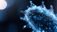 Glowing blue particles forming abstract splash shape against dark background, creating dynamic motion effect with bokeh light elements and scattered dots.