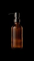 Amber glass bottle with black pump dispenser isolated on transparent background, ready for clipart, sublimation, print-on-demand products, stickers, and design projects.
