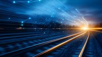 Futuristic railway tracks leading to bright horizon with glowing blue and orange light trails, digital network connections and particles in motion background.