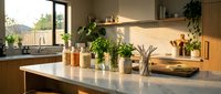 Modern kitchen interior with marble countertop, herbs in glass jars, wooden cutting board and copper containers creating warm cooking atmosphere.