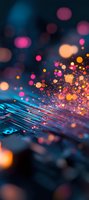 Glowing circuit board with magical bokeh lights in pink, orange and blue colors creating futuristic technology atmosphere. Abstract digital background for tech concepts.