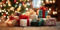 Festive holiday gifts wrapped in colorful paper with ribbons and bows on wooden table against blurred Christmas tree lights background.