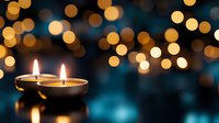 Glowing tea light candles with soft golden bokeh lights on dark teal background, creating peaceful ambiance for meditation or holiday decor.