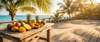 Tropical fruits on wooden table at beach resort with palm trees and ocean view during golden hour sunset creating paradise vacation atmosphere.