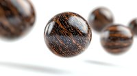 Dark brown wooden beads with natural grain pattern floating on white background, macro photography showing texture and detail of spherical decorative elements.