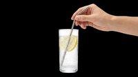 Hand holding stainless steel straw in glass of water with lemon slice, isolated on transparent background. Ready for t-shirt design, clipart, stickers, and print-on-demand products.