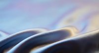 Abstract flowing curves with soft gradient colors creating smooth waves in purple, blue and golden tones for modern digital art and contemporary design projects.