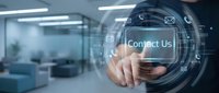 Businessman touching contact us button on digital interface in modern office environment for customer service and communication solutions.