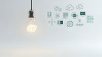 Glowing light bulb with technology icons representing innovation, artificial intelligence, cloud computing and digital transformation concepts.