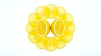 Fresh lemon halves and slices arranged in a circular pattern, isolated on white background. Vibrant yellow citrus fruit flat lay for food and health design.