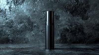 Black cosmetic bottle on dark textured background with water drops, dramatic lighting creates luxury atmosphere for premium skincare product presentation.