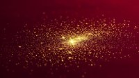 Golden particles burst with radiant light against deep red background creating magical sparkle effect for luxury designs and festive celebrations.