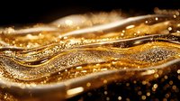 Luxurious golden waves with sparkling glitter particles flow in smooth curves against dark background, creating elegant abstract design for luxury branding and festive backgrounds.