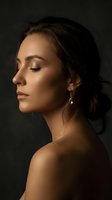 Young woman with elegant makeup in profile view against dark background for beauty and skincare campaigns.