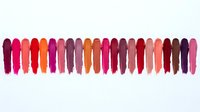 Colorful lipstick swatches in vibrant shades from pink to red arranged in row on white background for beauty and cosmetics marketing materials.