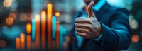 Businessman showing thumbs up gesture against background of growing financial chart with bokeh effect.