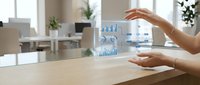 Businesswoman interacting with holographic data analytics and financial charts displayed in augmented reality above wooden desk in modern office environment.