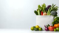 Fresh organic vegetables and fruits in white ceramic container against light background, healthy eating concept with copy space for text placement.