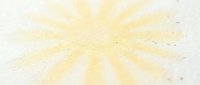 Golden sunburst rays radiating from center with sparkling particles on light background for spiritual enlightenment and positive energy concepts.
