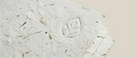 Handmade paper texture with natural fibers and organic materials creating rustic craft background for artistic projects and eco-friendly designs.