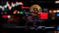 Golden bitcoin coin in miniature shopping cart against blurred trading chart background, representing cryptocurrency market and digital payment trends.