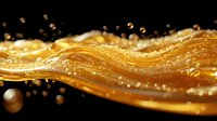 Flowing golden liquid with bubbles and droplets captured in dynamic motion against black background, creating luxurious wave effect for cosmetic advertising.