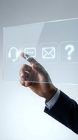 Businessman hand touching transparent digital interface with communication icons including headset, chat, email and question mark for customer service.