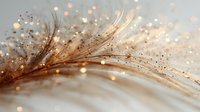 Delicate golden feather with sparkling water droplets and bokeh lights creating dreamy atmosphere. Perfect for nature-inspired designs.